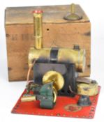 Bowman M140 live steam engine with twin oscillating cylinders and geared drive, all mounted on a red