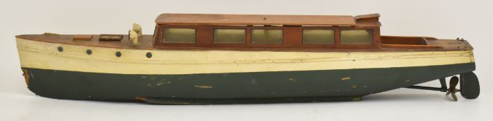 Vintage carved wood model motor boat with brass fittings and vintage electric motor, overall