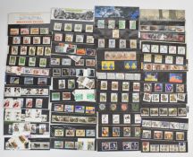 Sixty three Great Britain Presentation packs 1982-1993, some with gutter pairs