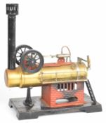 Bing or similar live steam stationary engine, with brass boiler on faux brick base with twin
