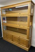 Light oak display cabinet bespoke built for the vendor (at a cost of around £3,000) in order to