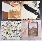 Nine Led Zeppelin LPs comprising Led Zeppelin I, II, III (with rotating wheel) and IV, Presence,