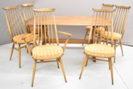 Ercol mid-century modern elm dining table and a set of six chairs including two carvers, table