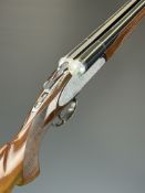 Fausti 12 bore side by side ejector shotgun with engraved scenes of birds and dogs amongst scrolling