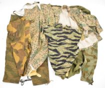 Large collection of mainly German reproduction camouflage uniform