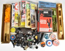 A collection of gun accessories and shooting related items including Shooting Times, The Field and