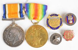 South African / Rhodesian WW1 medal pair and four badges comprising British War Medal and Victory
