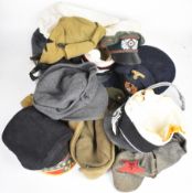 Large collection of military hats including Russian, German, Soviet Union including examples with