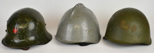 Three Eastern European WW2 era / Cold War helmets comprising Bulgarian M36-A steel helmet with