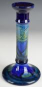 William Moorcroft candlestick decorated in the Moonlit Blue pattern, signed and with impressed marks