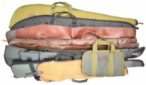 Eight shotgun or rifle slips together with a Napier pistol or revolver case.