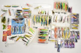 Large collection of predator, coarse and sea fishing lures, plugs and soft plastics, some in