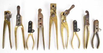 Nine pairs of brass pistol, bullet and rifle bullet moulds including Colt .44, Hotchkiss and