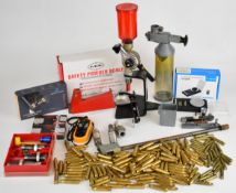 A collection of re-loading equipment including 100 .243 and 100 .556 cases, Fiocchi small rifle
