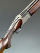 Nikko Model 5000 II 12 bore over and under ejector shotgun with engraved locks, trigger guard,