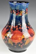 William Moorcroft large baluster pedestal vase decorated in the Pomegranate pattern, signed and with