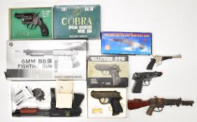 Six replica or model guns including Colt Cobra, Walther PPK, Cap Machine Gun, Remington Riot Shotgun