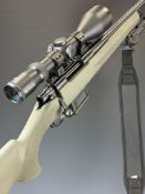 Howa Model 1500 .243 bolt-action rifle with composite stock, textured semi-pistol grip and forend,