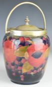 William Moorcroft biscuit barrel decorated in the Pomegranate pattern, with plated mount, swivel