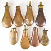 Eight various powder flasks including G&JW Hawksley and Sykes, one with embossed decoration, on