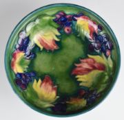 Moorcroft pedestal bowl decorated in the Leaf and Berry pattern, with impressed marks to base, H6.