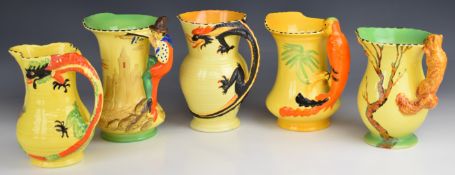Five Art Deco Burleigh ware jugs including two with figural dragon handles, pied piper, etc, tallest