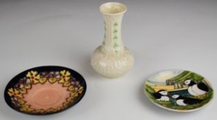 Two Moorcroft pin dishes and a Belleek vase, tallest 13.5cm