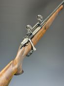 Mauser .243 bolt-action rifle with chequered semi-pistol grip and forend, raised cheek piece,