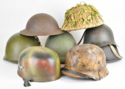 Eight Russian / Soviet and German military helmets, some reproductions