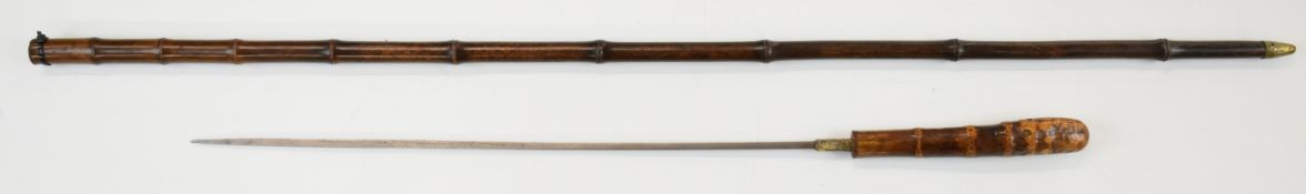Early 20th century bamboo swordstick with 39cm square tapering blade, overall length 88.5cm.
