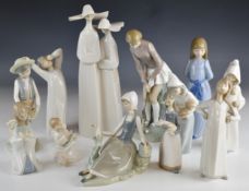 Eleven Lladro / Nao figures including a golfer, tallest 30cm
