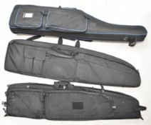 Three shotgun or rifle slips including travel examples with exterior pockets and space for