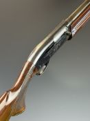 Remington Model 1100 12 bore 3-shot semi-automatic shotgun with ornately carved and chequered semi-
