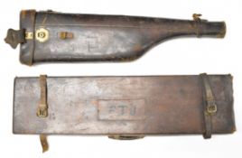 Two leather bound shotgun carry cases, one leg of mutton the other with fitted interior and 'John