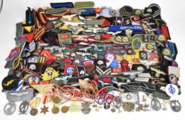 Large collection of mainly reproduction Nazi German / Soviet / Russian cloth insignia, badges and