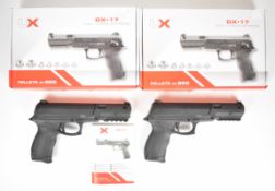 Two UX Dual Xtreme DX.17 .177 CO2 air pistols, each with composite body and fixed sights, serial