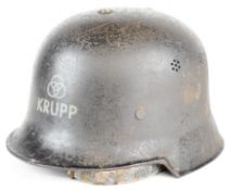 Nazi German / Third Reich Civil Defence M34 steel helmet with Krupp decal to front and erased double