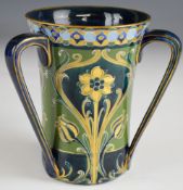 William Moorcroft Macintyre Florian Ware green and gold tyg decorated with tulips, with signed and