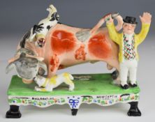 19thC Staffordshire figure with captions 'Bull Beating and Now Captin Lad', H17cm