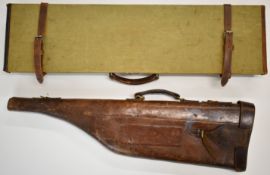 Two vintage leather gun cases comprising a canvas and leather bound example with fitted interior (