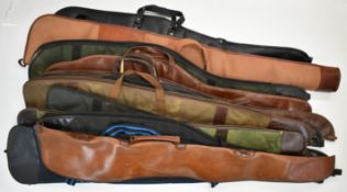 Twelve various shotgun or rifle slips including faux leather and padded examples.