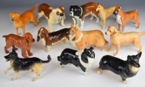 Twelve Beswick dog figures including Greyhound, Boxer, Corgi, etc tallest 14cm