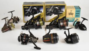 Seven fixed spool fishing reels including two Daiwa BR2650 and Intrepid Envoy, all boxed, and closed