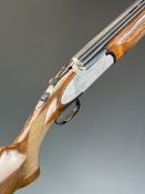Rizzini 12 bore over and under ejector shotgun with engraved scenes of birds to the sidelock