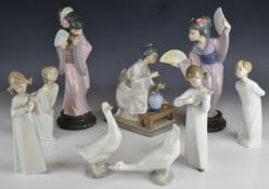 Nine Lladro / Nao figures including Geishas, tallest 28cm