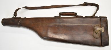 Leather leg of mutton shotgun carry case with brass lock and shoulder strap, 79cm long.