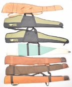 Seven various shotgun or rifle slips including Buffalo River and wool lined examples.