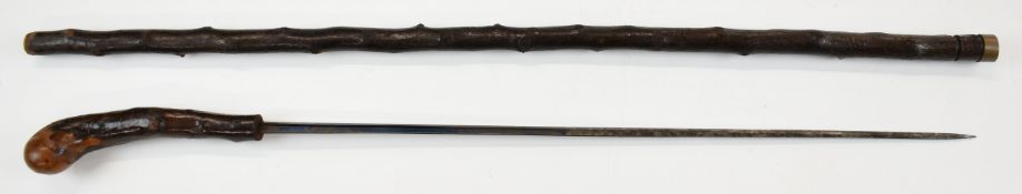 Blackthorn swordstick with brass collar and 52cm blued steel double edged blade, overall length