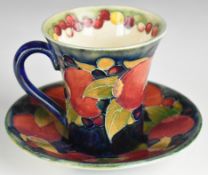 William Moorcroft coffee can and saucer decorated in the Pomegranate pattern, signed and with
