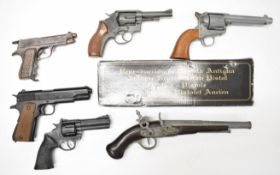 Six replica pistols and revolvers including Colt Single Action Army .45, Smith & Wesson, Mountie,